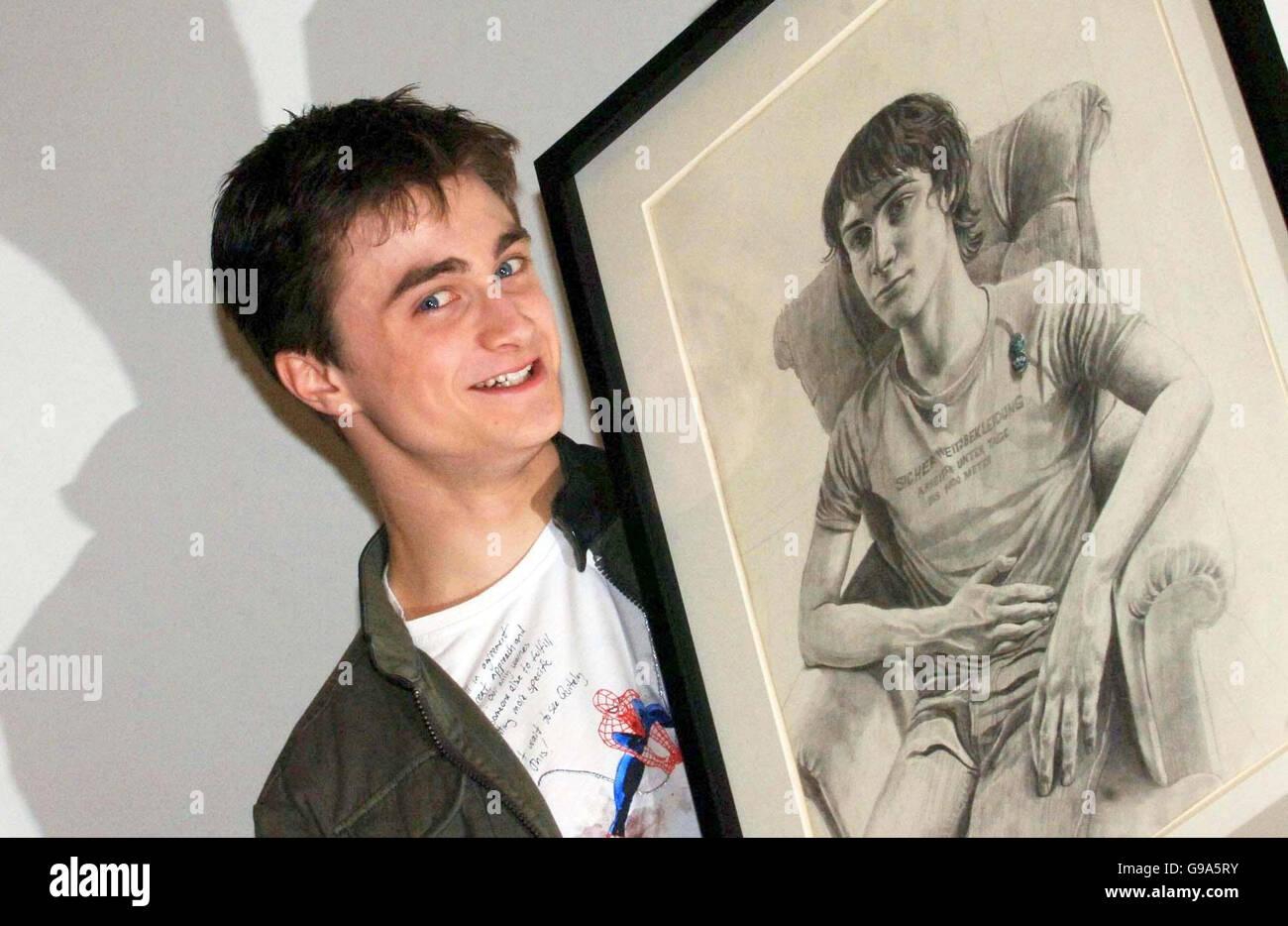 <b>Harry Potter</b> star <b>Daniel Radcliffe</b> stands next to his <b>portrait</b> at ...