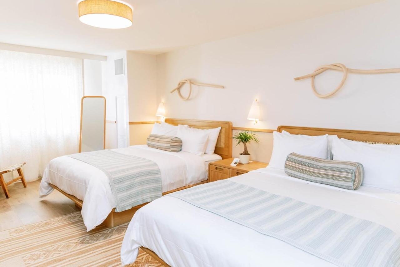 Kamer met 2 Queensize Bedden - Geschikt voor Gasten met een Lichamelijke Beperking